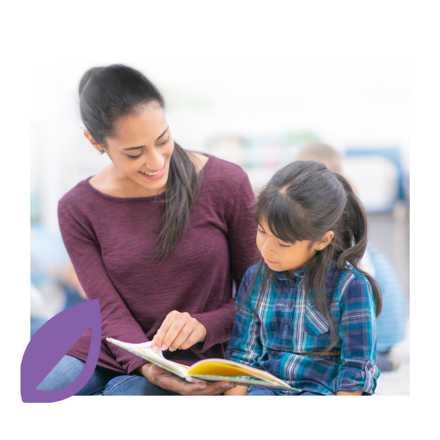 Happy adult reading with a child.